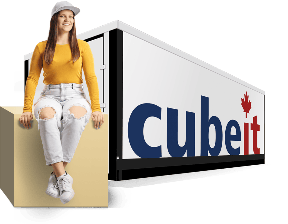 Woman sitting on box with Cube in backdrop